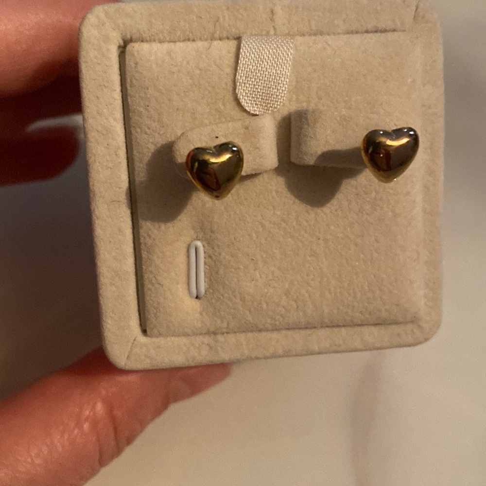 Gold tone heart shaped earrings